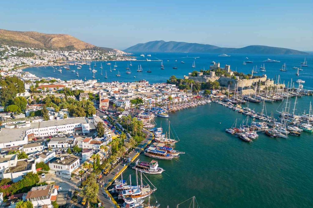 Bodrum's charming harbor filled with traditional Turkish boats known as gulets.